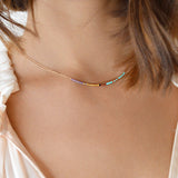 A female model wearing an Elvira minimalist rose gold dainty necklace by Kurafuchi Jewelry.