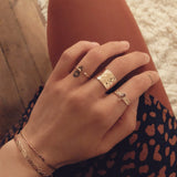 A female model's hand and wrist showcasing Kurafuchi jewelry designs.