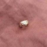 Thick gold ear cuff in a retro design. By Kurafuchi.