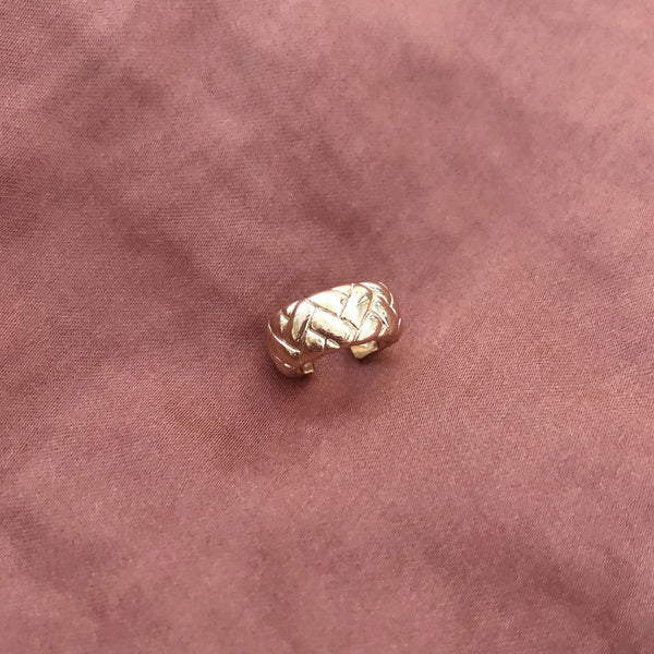 Thick gold ear cuff in a retro design. By Kurafuchi.