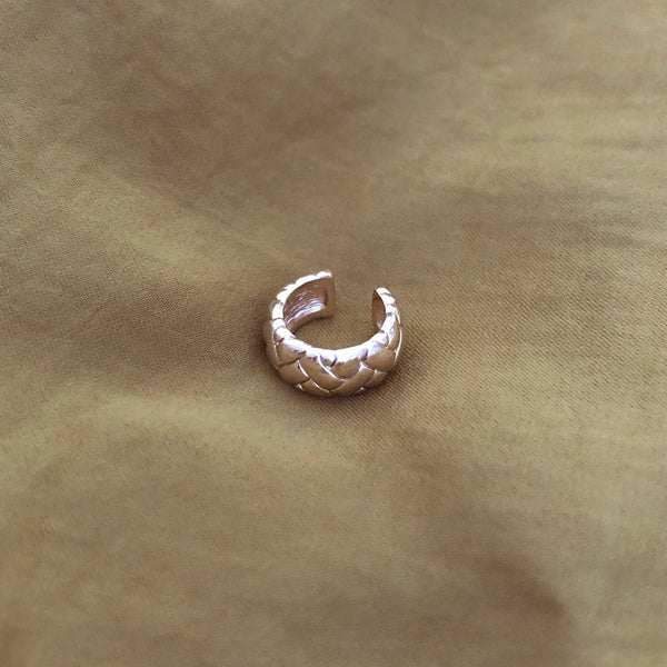 Thick gold ear cuff in a retro design. By Kurafuchi.