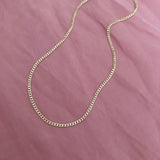 Plain chain gold necklace by Kurafuchi Jewelry.