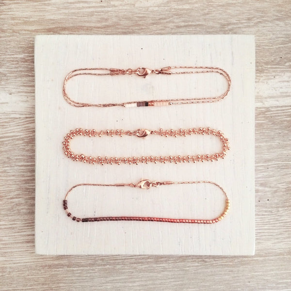 Photo of three Kurafuchi dainty bracelets in different styles.