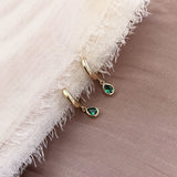 Lovely small gold hoops, each decorated with a teardrop-shaped green crystal zircon.