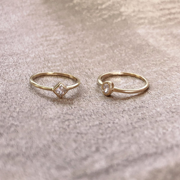 Beautiful gold crystal rings featuring a zircon crystal in a round or geometric shape. By Kurafuchi.
