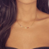 A female model wearing an Elvira minimalist dainty double necklace by Kurafuchi Jewelry.