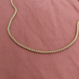 Elegant gold tube necklace by Kurafuchi.
