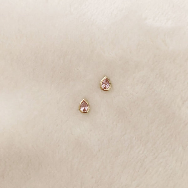 Pretty teardrop-shaped stud earrings with pink zircon crystals. By Kurafuchi.