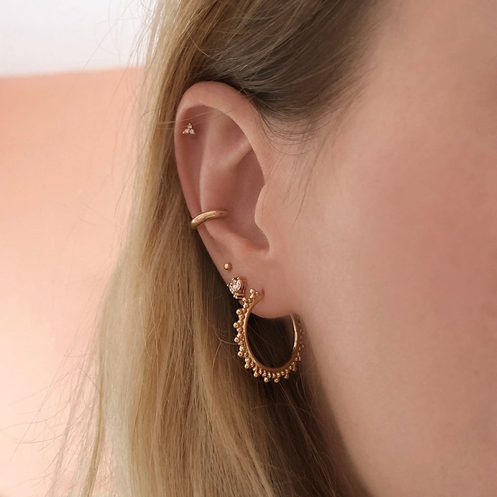 Pair of long Gamble gilded metal earrings holding two …